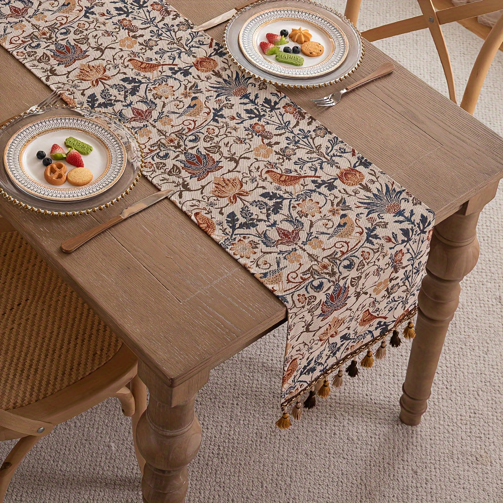 Vintage floral and bird jacquard table runner with tassels in rustic countryside style. Made of polyester, 33cm wide. Ideal for dining, coffee, and tea tables. Vintage design with polyester fabric.