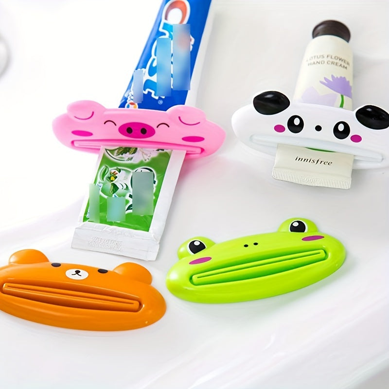 Set of 4 plastic squeezer clips for toothpaste and hand cream with cute animal designs - manual dispensers for tubes, no electricity required.