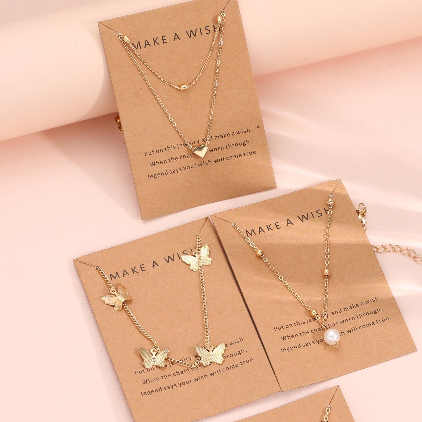 Set of 6 elegant pendant necklaces with butterfly, star, moon, and heart charms. Made of zinc alloy with no plating. Versatile fashion jewelry for women, perfect for daily wear or vacation.