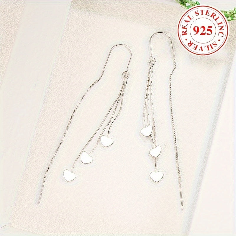 Elegant and simple, these glossy heart chain tassel dangle earrings are made of hypoallergenic sterling silver (925). The perfect delicate gift for a female, they will add a touch of elegance to any outfit.