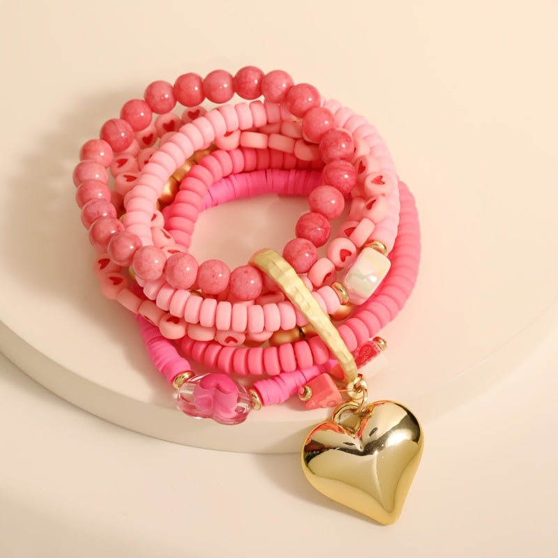 Introducing a versatile Bohemian-style bracelet made of multi-layered pink resin beads, ideal for women looking to elevate their Valentine's Day fashion. Adorned with charming heart inlays, this accessory can be worn for both casual and special