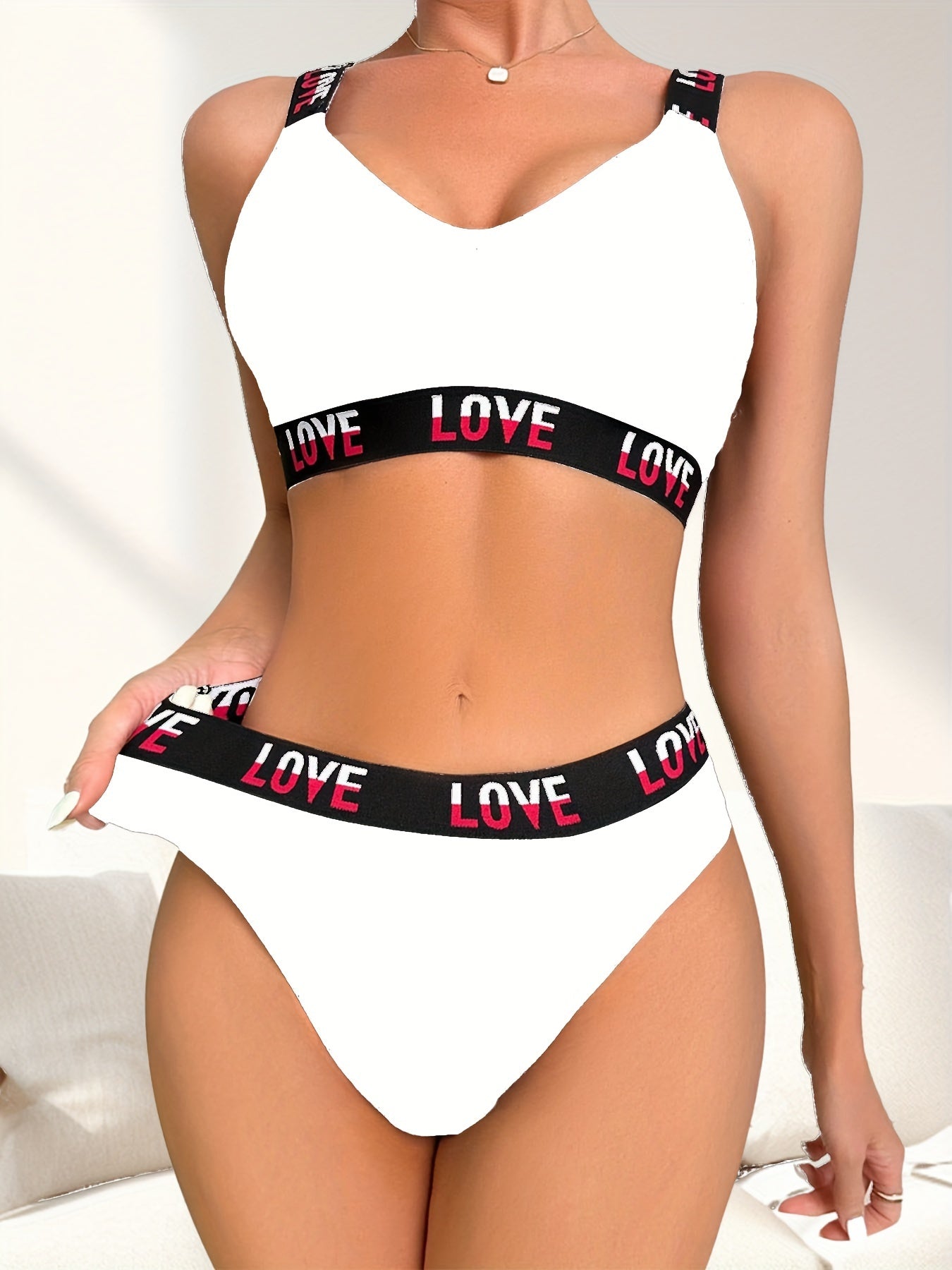 Ribbed bra and thong set with contrasting color letter print.