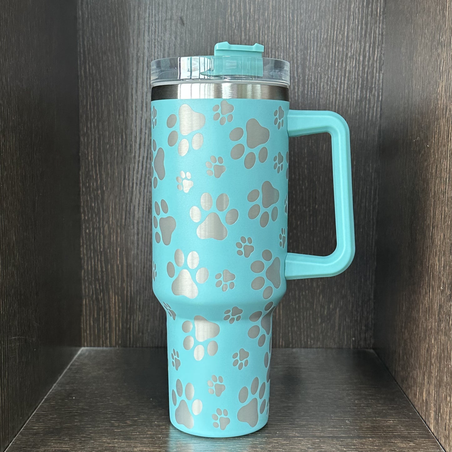 Insulated stainless steel tumbler with cat paw pattern, 40 oz. Double wall vacuum cup with lid and handle. Great for car travel and daily use. Perfect gift for cat lovers.