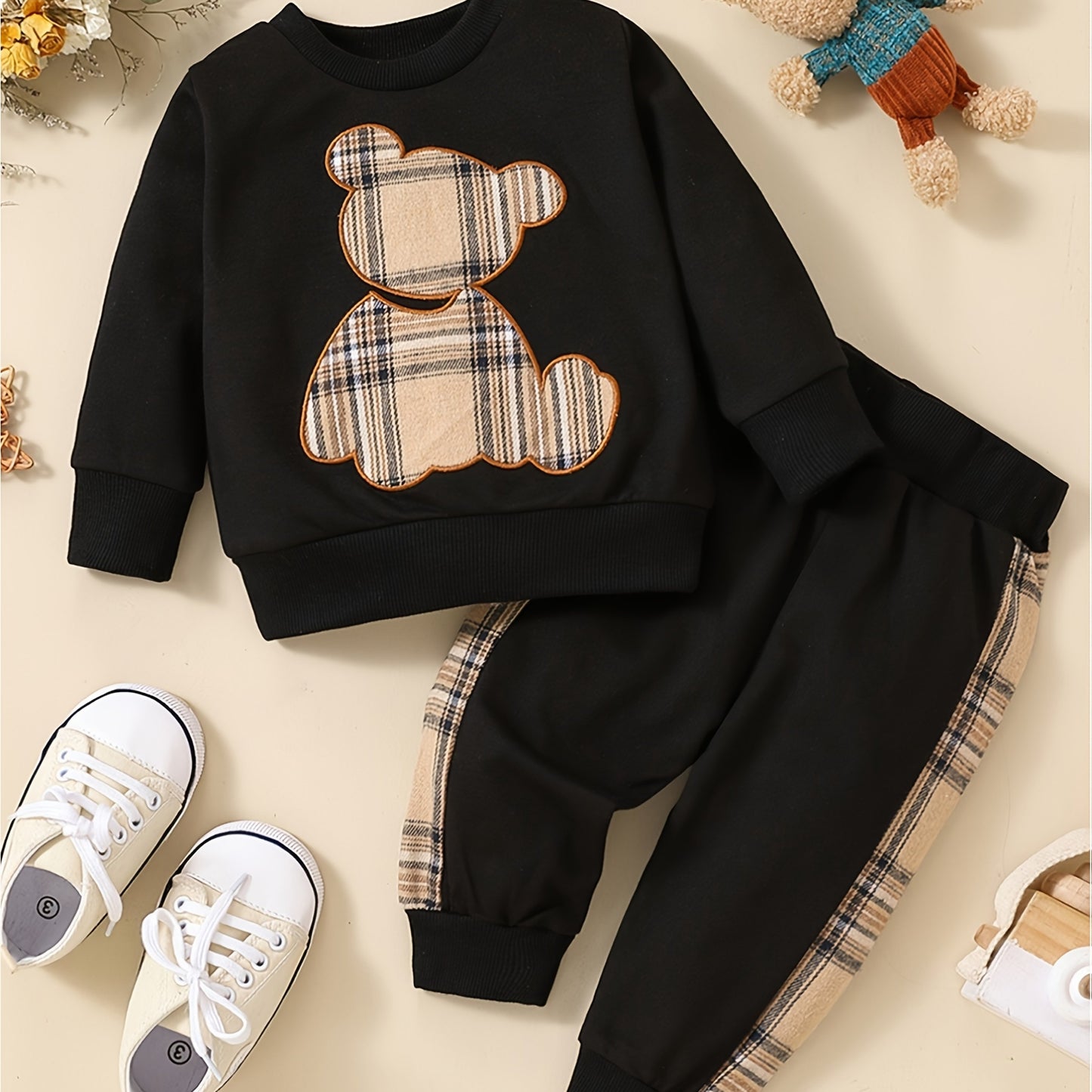 Toddler boy's outdoor fall/winter outfit with long sleeve sweatshirt and casual pants.