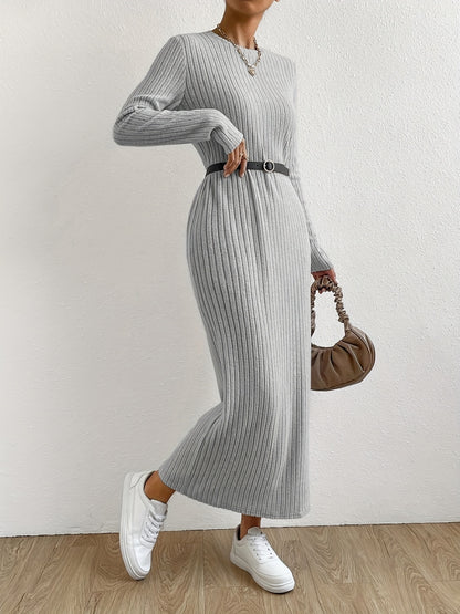 Elegant crew neck striped knit t-shirt dress made from a polyester and spandex blend. Features long sleeves and full-length ribbed knitwear for spring/fall.