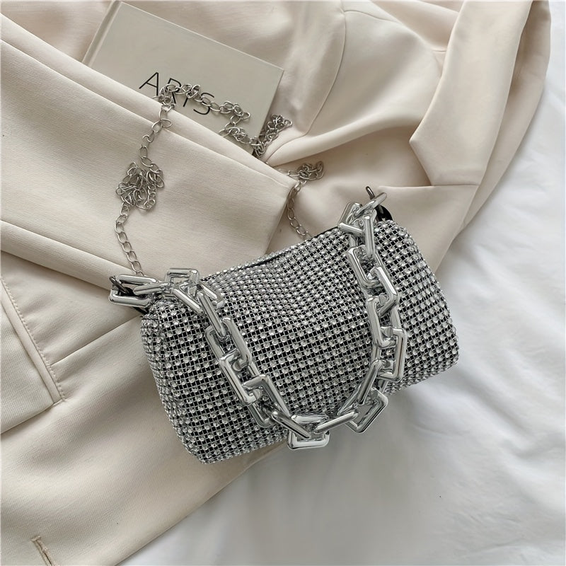 Metallic evening bag with chain strap, zip closure, and polyester lining in silver grey - a stylish accessory for women.