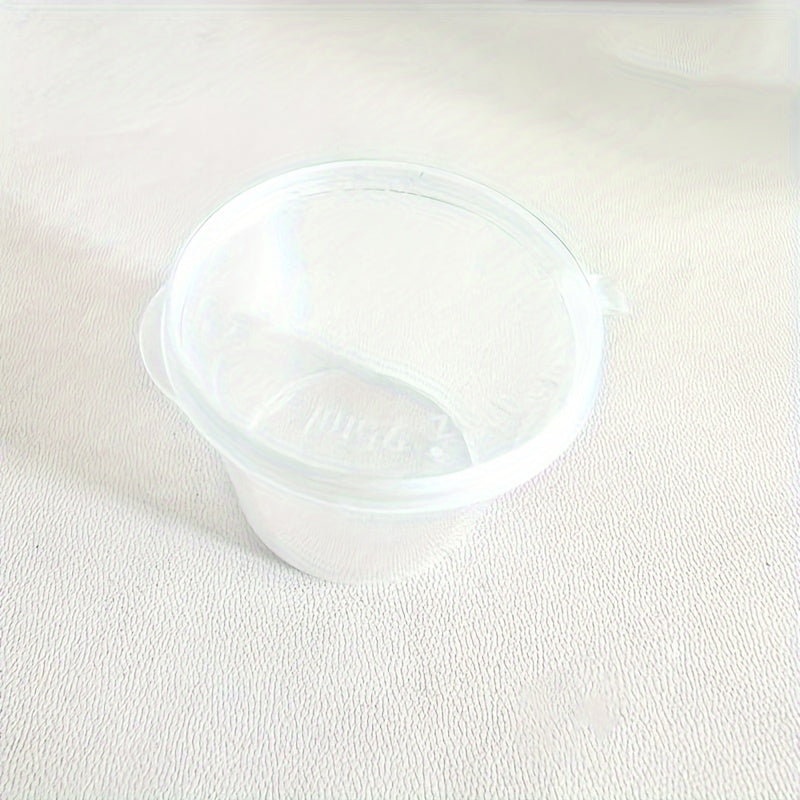 50 transparent disposable sauce boxes for takeout, packaging, and seasoning. These multipurpose food storage boxes come with covers.