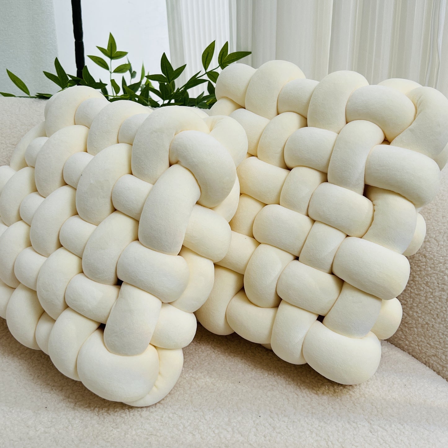 Soft knot throw pillow, ideal for home decoration in living rooms, bedrooms, and offices.