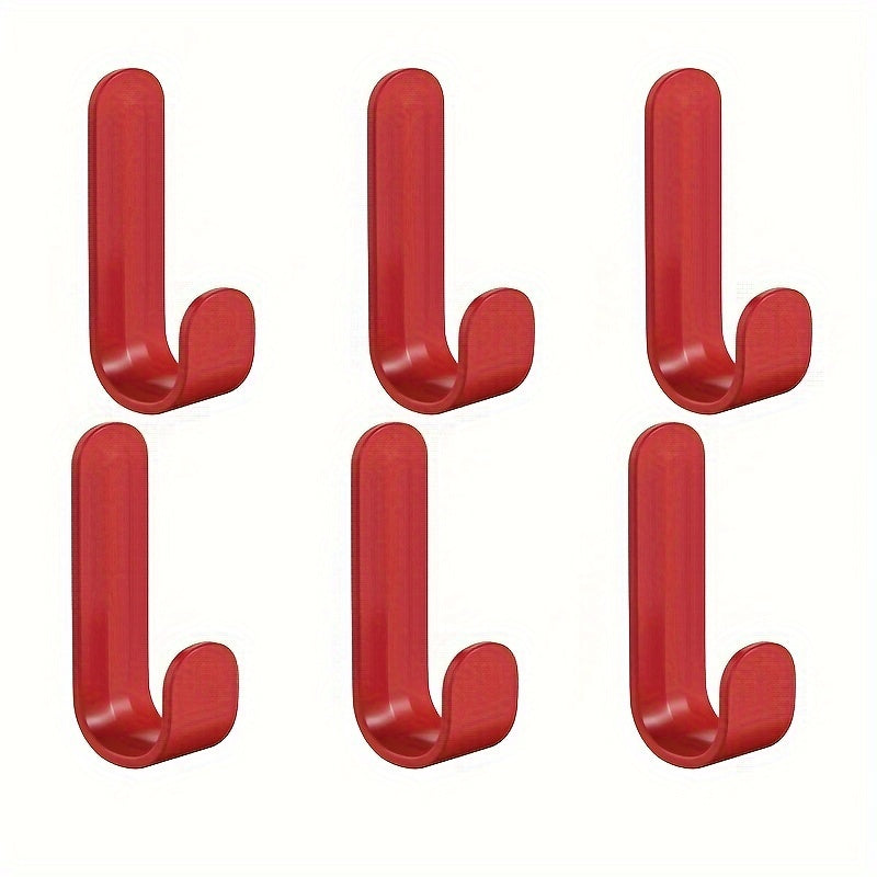 6 J-shaped hooks for hanging clothes on doors or walls without damaging them.