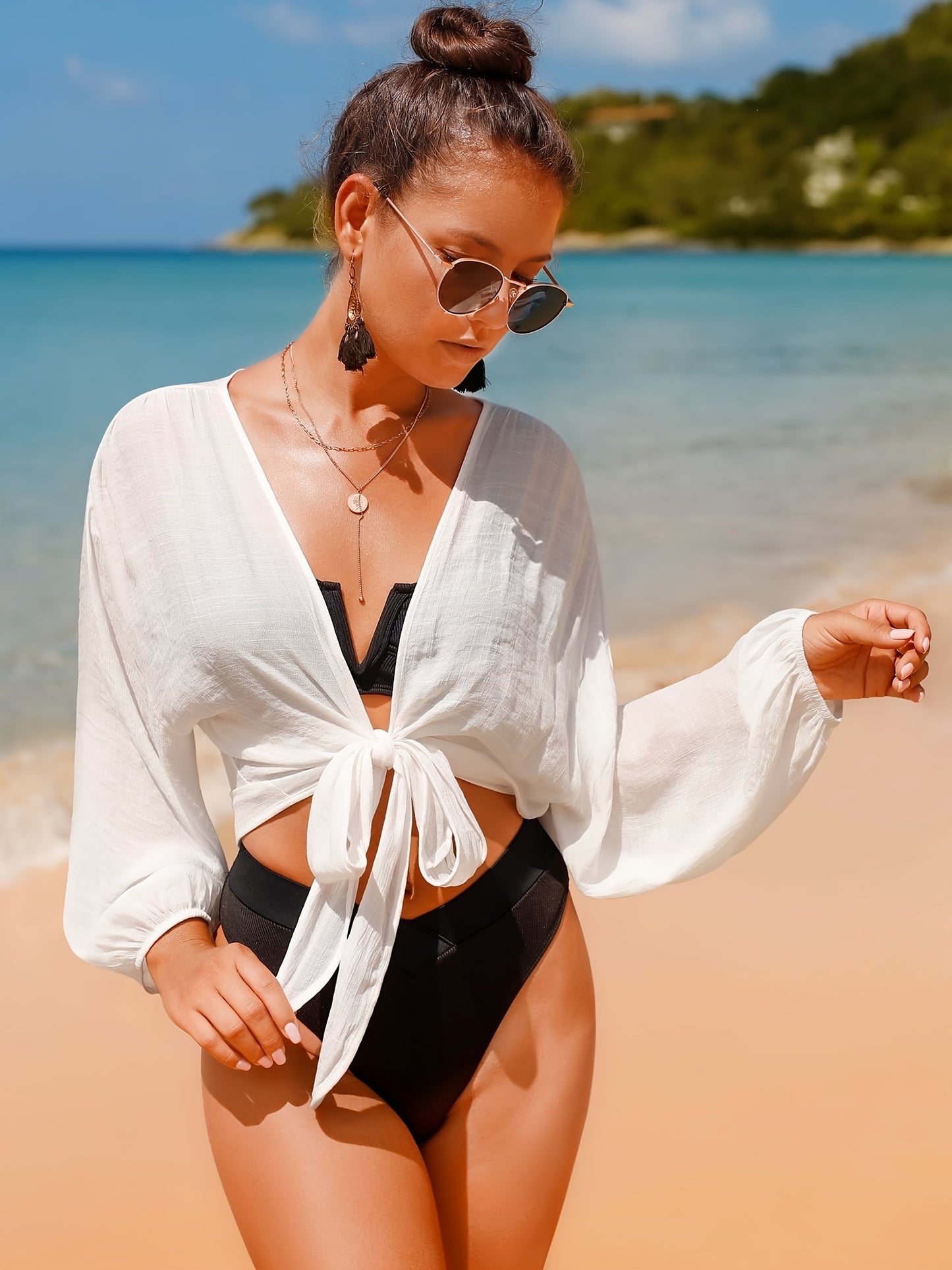 Women's swimwear cover up top with long sleeves and self-tie design for women.