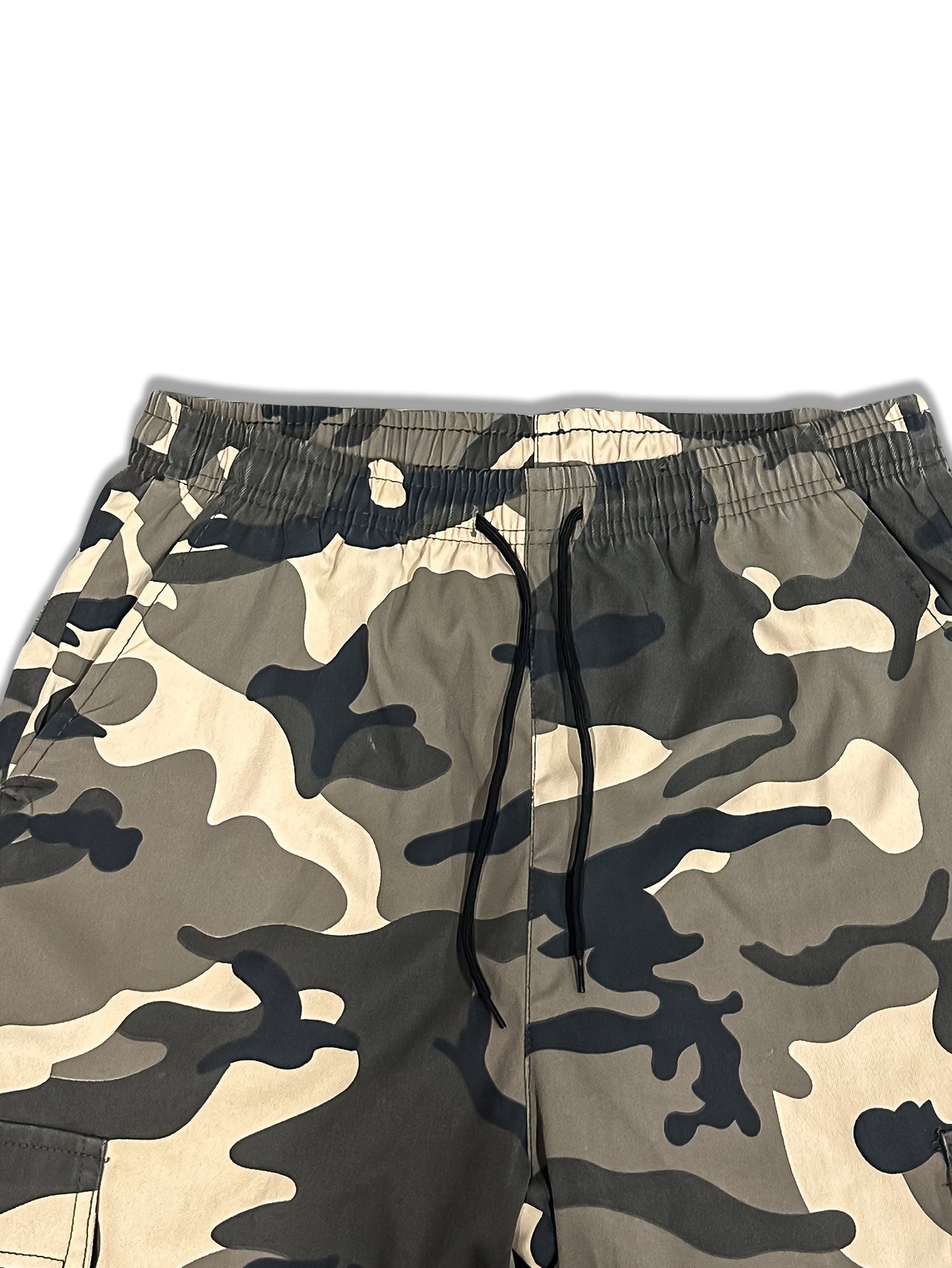 Men's camo cargo pants made from 100% non-stretch polyester fabric with a drawstring waist and flap pockets. Suitable for outdoor work.