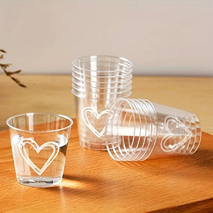 50 or 100 elegant heart-shaped disposable plastic cups with lids, ideal for weddings and parties. Recyclable, lead-free, and shatterproof, perfect for serving coffee, desserts, and more.