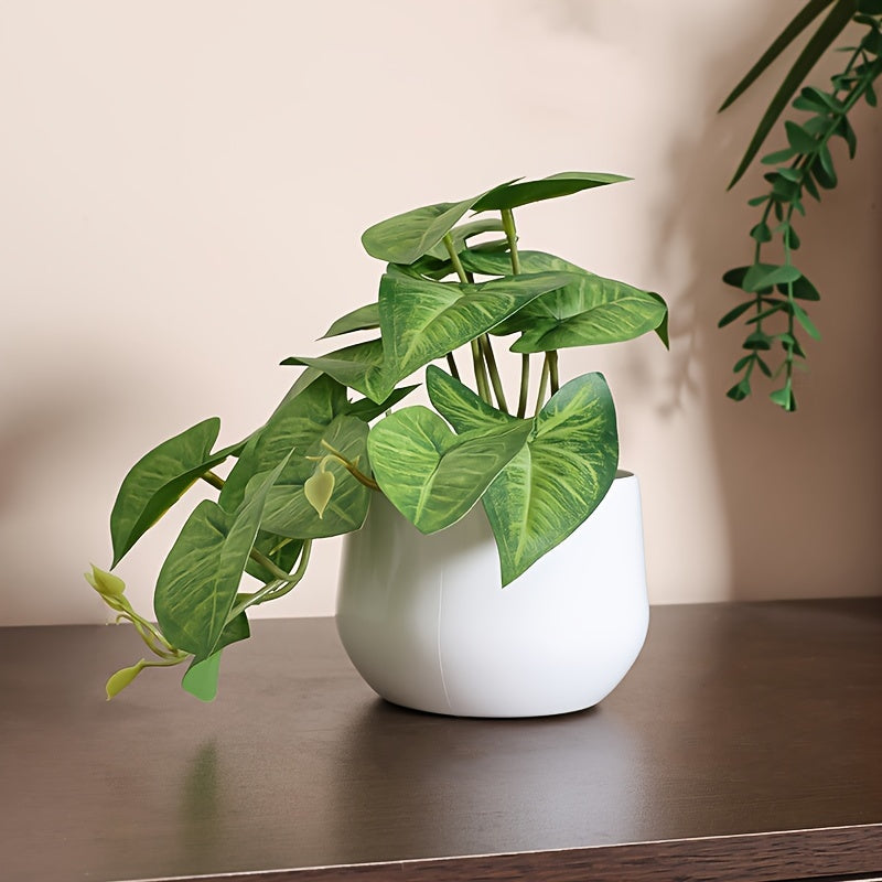 Artificial green leaf plant for home, office, or shelves décor.