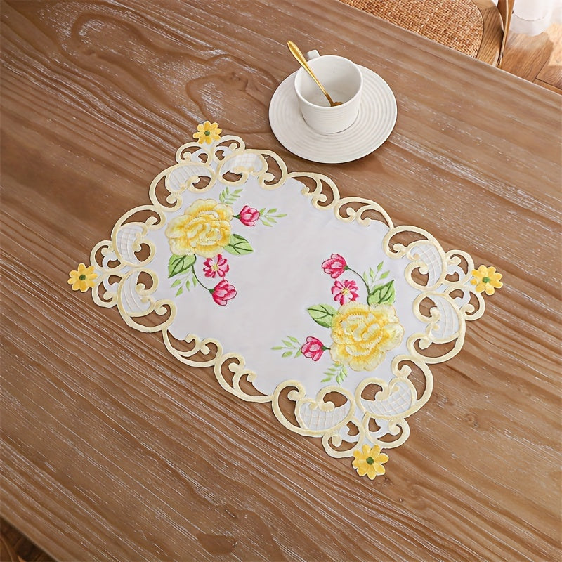 Elegant polyester table runner with hand-cut embroidered flowers and butterflies, perfect for home decor, restaurants, picnics, and parties. White base with vibrant floral patterns.