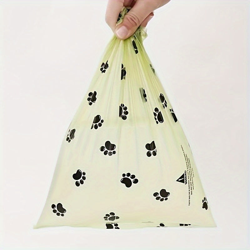 - 14 rolls of leak proof dog waste bags with cute paw print design for pet cleaning and outdoor use.