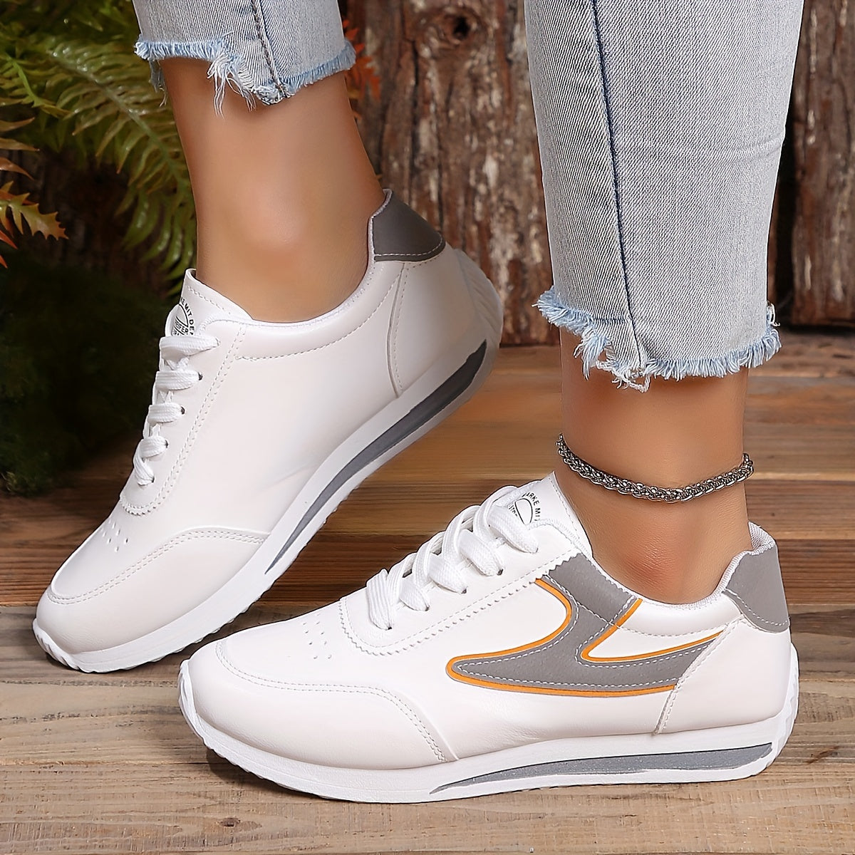 Women's flat lace-up sneakers for outdoor casual wear, comfortable low top shoes.