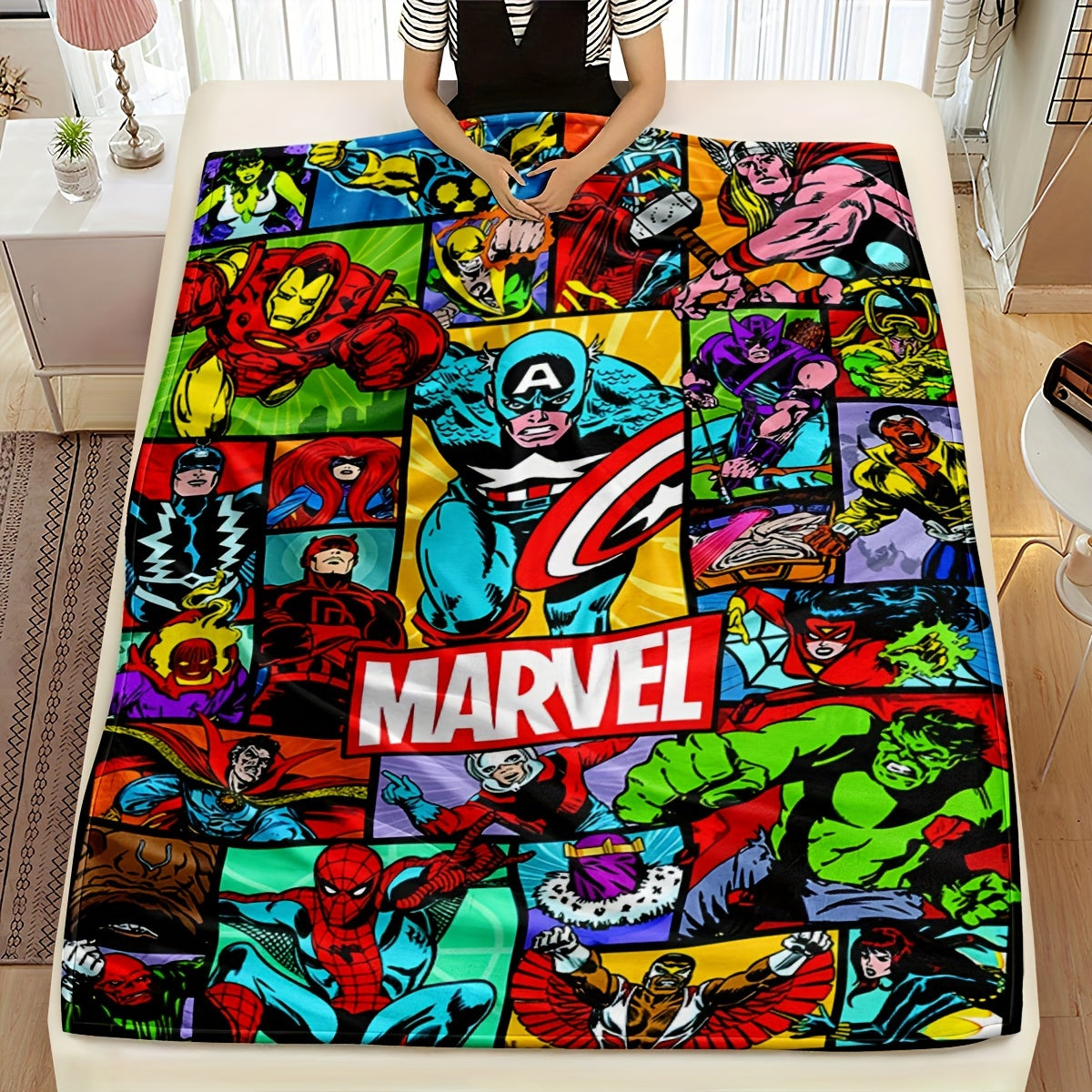 Cozy up with this Marvel Superhero Plush Throw Blanket featuring a vivid digital print. Made for all seasons, this knit bedding is perfect for the sofa, travel, camping, bedroom, and even the car. It's the ideal gift for your son.