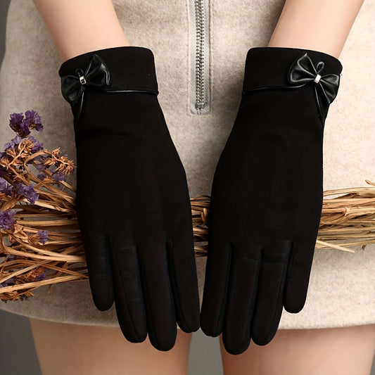 Warm winter gloves made with velvet, featuring a stylish and elegant bow decoration. These short, solid-colored gloves are touch screen compatible and have an elastic fit, making them perfect for women.