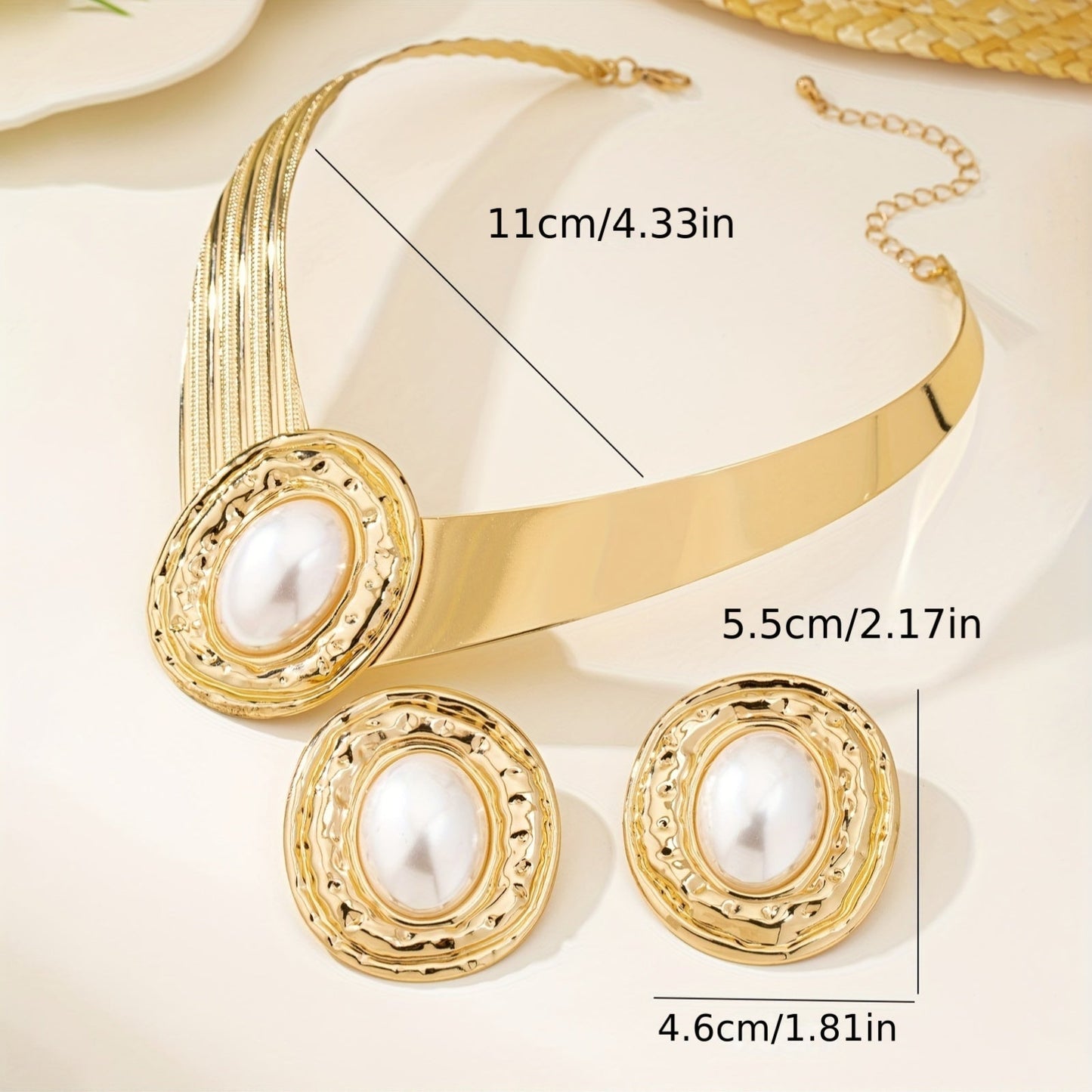 A stylish and modern set of golden pearl earrings and necklace for women, a stunning jewelry set that makes a statement - ideal for giving as a gift on special occasions.