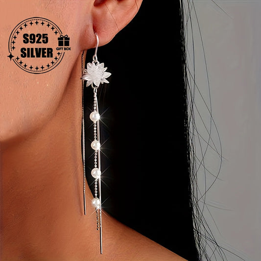 A pair of elegant drop earrings made from 925 sterling silver, with a freshwater pearl design that is hypoallergenic and suitable for daily wear or special occasions. A perfect accessory to complement any outfit, this jewelry makes a thoughtful gift for