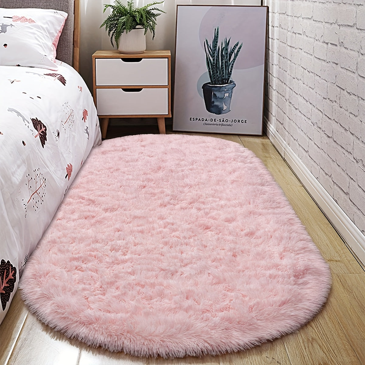 Soft and fluffy oval shaggy area rug, perfect for bedroom or living room. Made with skin-friendly thickened sponge and tufted polyester material. Durable and easy to maintain. Adds decorative touch to indoor spaces such as sofa, bedside, playroom, or