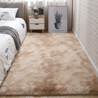 Soft fluffy area rug for bedroom, featuring a non-slip fuzzy shag plush design. This shaggy bedside rug is perfect for girls, kids, babies, teens, and dorm rooms. The tie-dyed pattern adds a fun touch to any living room or nursery. Measures 31.5*62.99