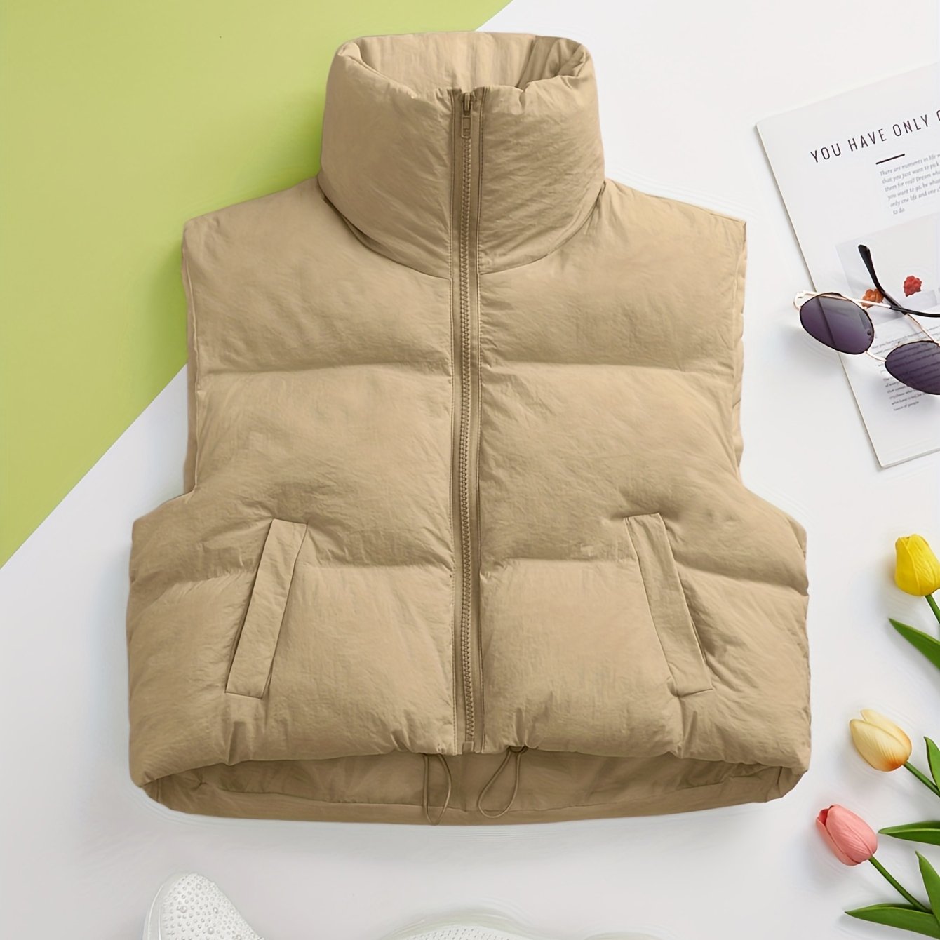 Women's solid zip-up puffy vest with casual sleeveless pockets, perfect for fall and winter.