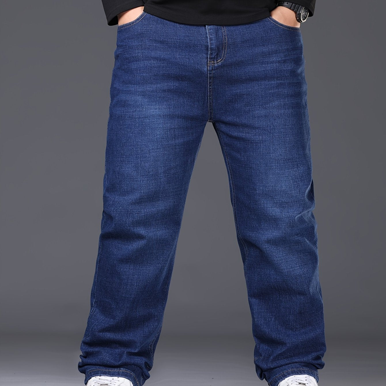 Men's solid denim pants for spring and fall in plus sizes.