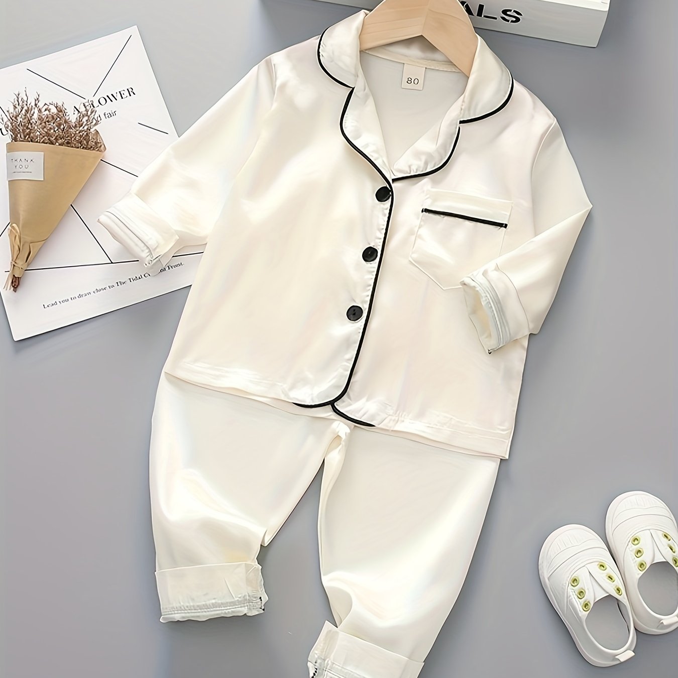 Boys' classic long sleeve pajama set made with polyester, featuring a lapel collar, button front, and regular fit for spring/fall.