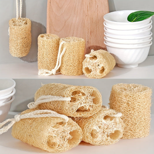 A set of four natural loofah sponges made from wood pulp fiber. These rectangular sponges are lightweight and made from non-woven fabric, making them reusable for various purposes such as bathing, spa treatments, skincare, kitchen cleaning, dishwashing