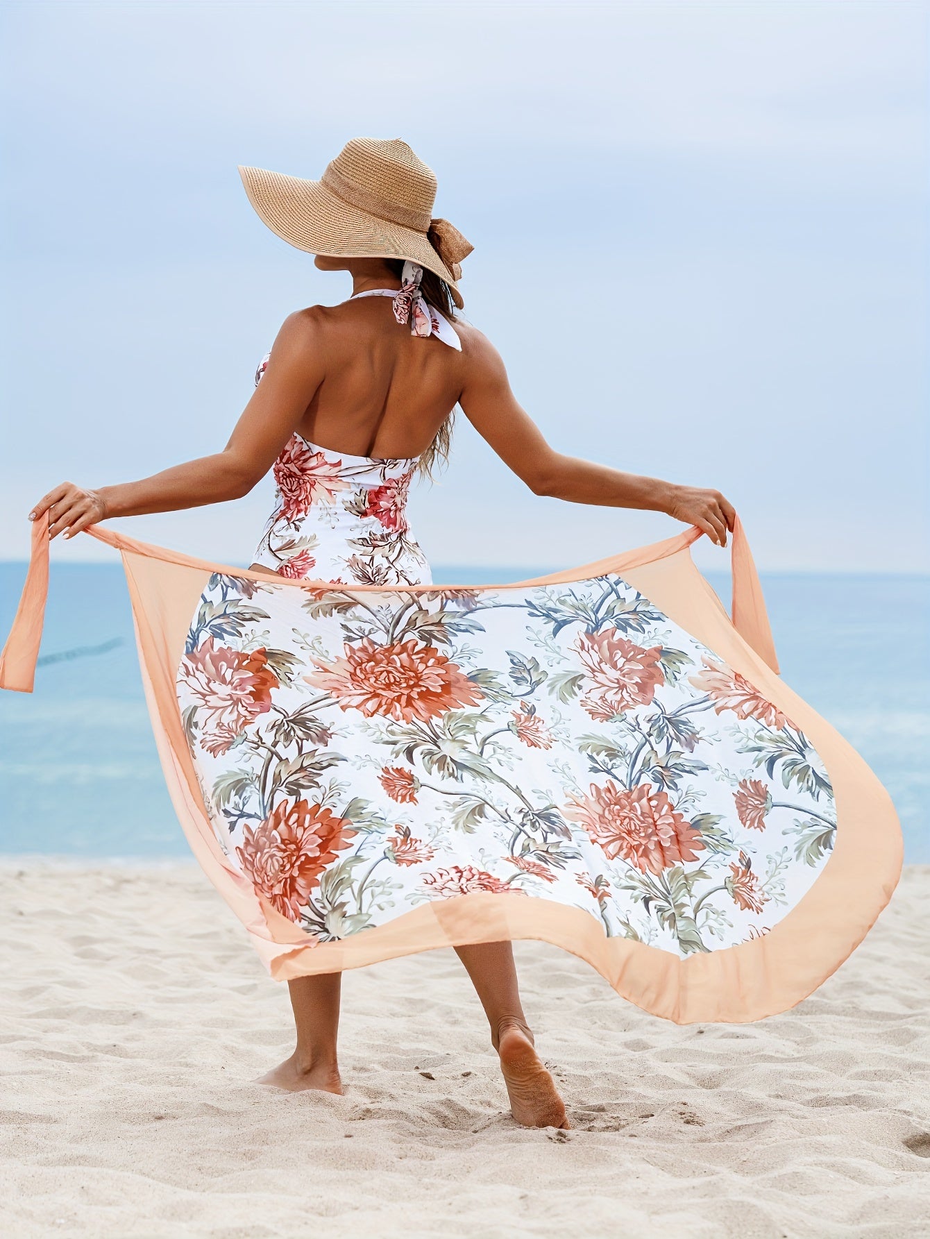 Women's floral print swimsuit set with tummy control one-piece and cover up skirt for holiday.