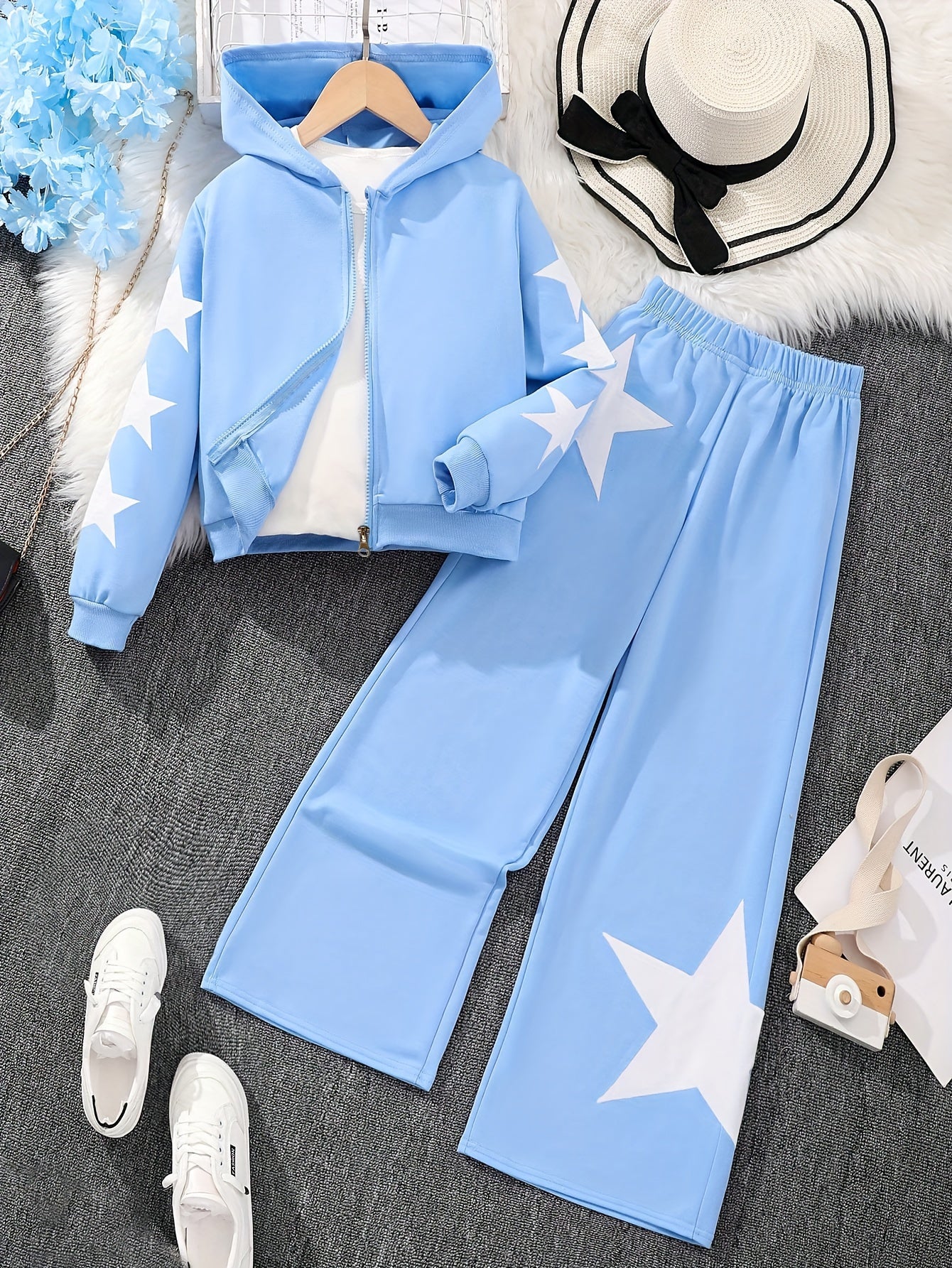 Polyester zip-up hoodie and pants set for girls with star pattern. Machine washable for easy care. Ideal for casual fall/winter outfits and outdoor activities.