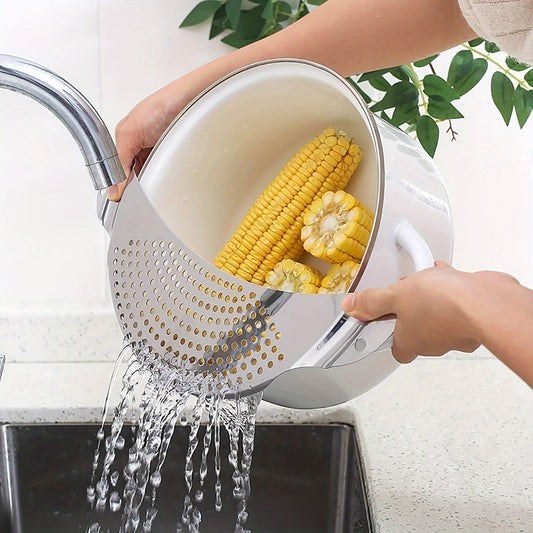 A kitchen filter made of stainless steel, designed for washing vegetables, filtering water, separating liquids, and draining excess water.