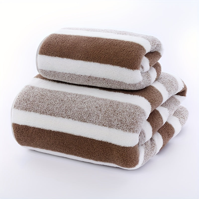 Two pieces of towels with a striped pattern, featuring a soft hand towel and a bath towel. These quick-drying, absorbent towels are perfect for the bathroom and come as part of your bathroom supplies.