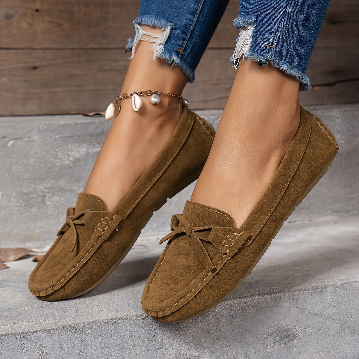 Retro flat loafers with bow detail, slip on style, and soft sole for casual wear.