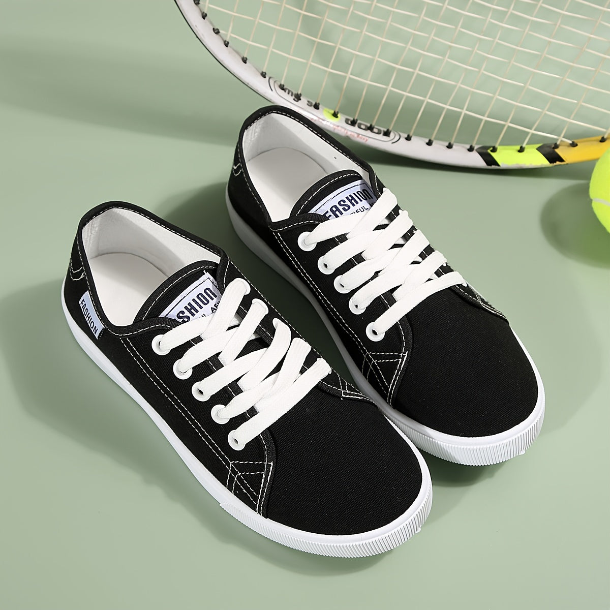 Black & white lace-up sneakers for women with round toe, low-top design, and comfortable EVA sole.