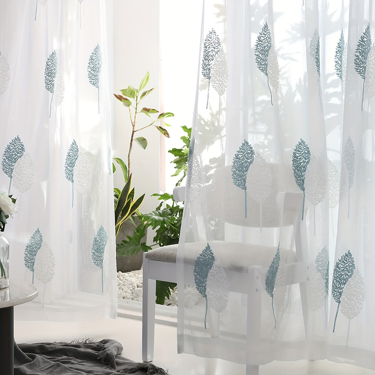 Add a touch of pastoral elegance to your home with this beautiful sheer curtain featuring delicate leaf embroidery. This translucent tulle curtain is easy to hang with a rod pocket design, perfect for adding a subtle touch of style to your living room or