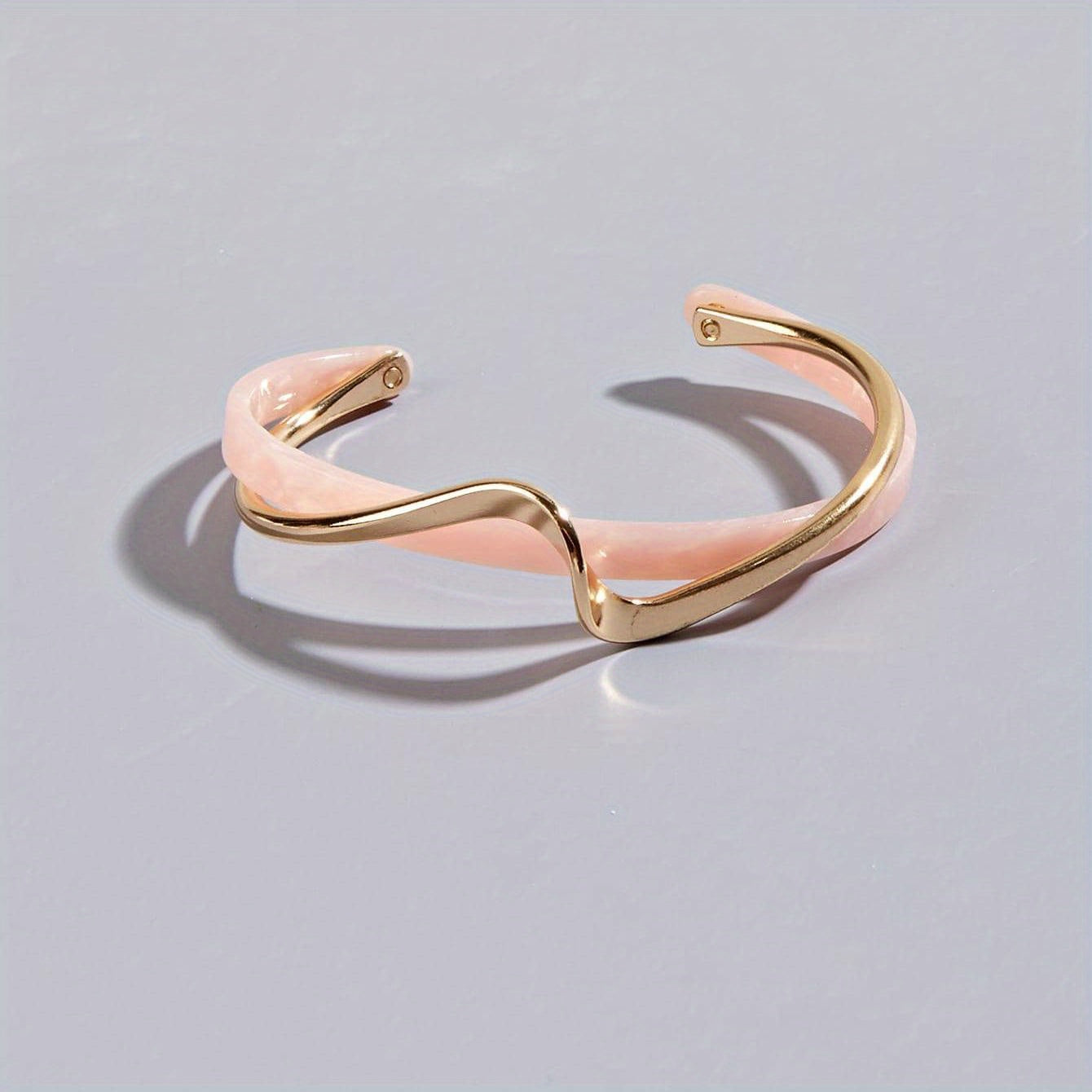 Wave-shaped cuff bangle with faux pearl inlay, featuring a minimalist style in 18K gold plating, ideal for women's jewelry collection