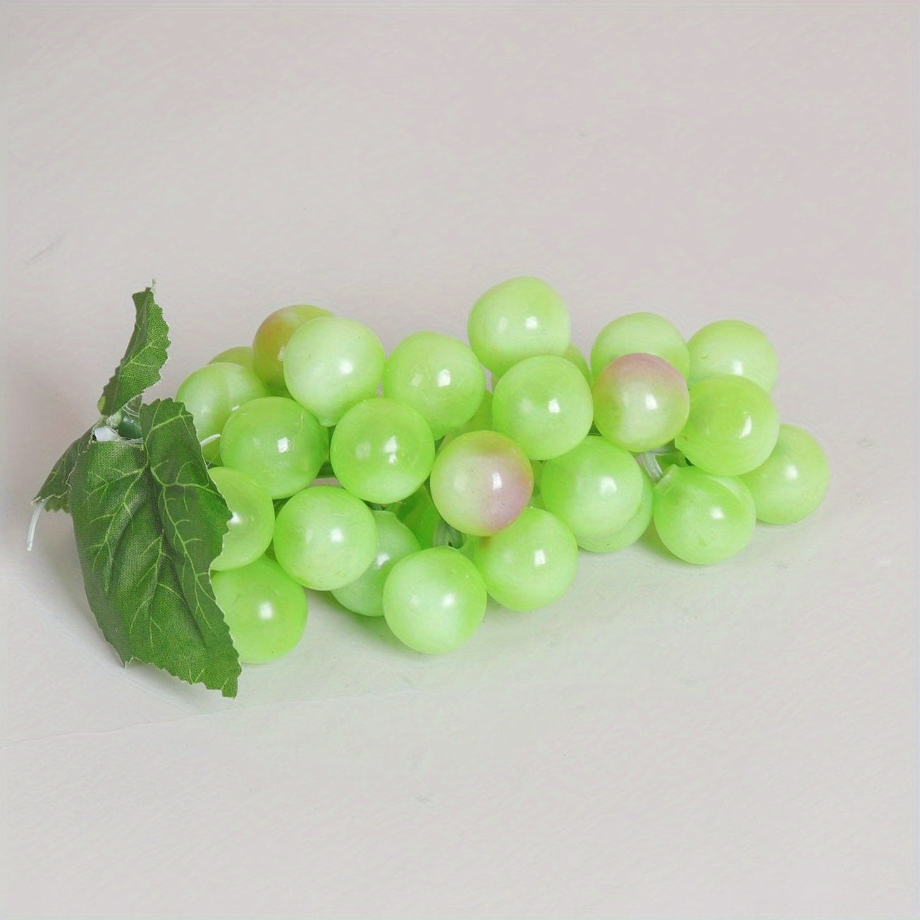 A string of artificial grapes with 36 large beads per string can be hung up for Halloween and Thanksgiving parties, as well as for weddings, kitchen displays, and Christmas gifts.