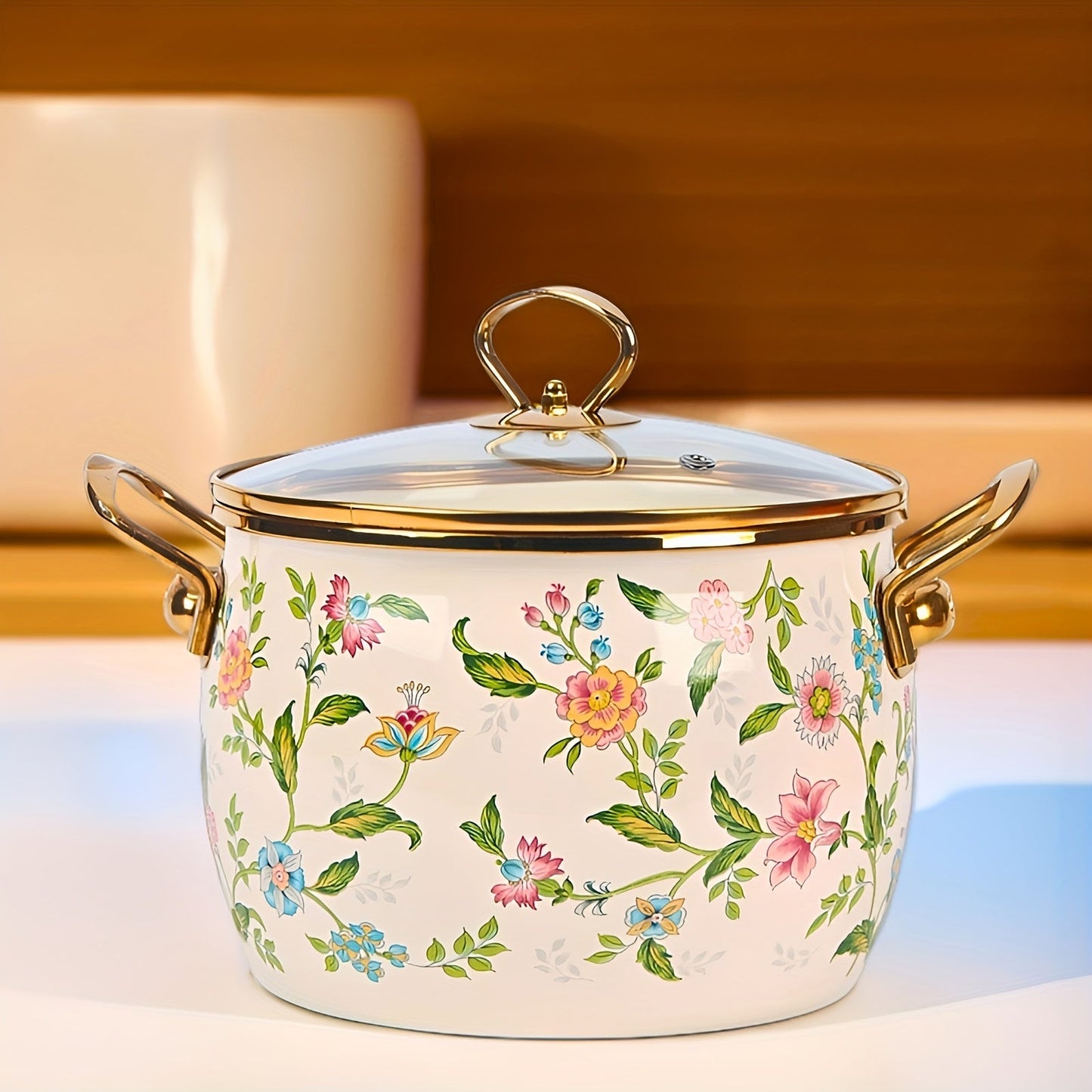 Large capacity enamel saucepan with glass lid and floral design is a non-stick, dishwasher-safe kitchen cookware with double handles. This soup pot features a golden handle for added style and convenience.