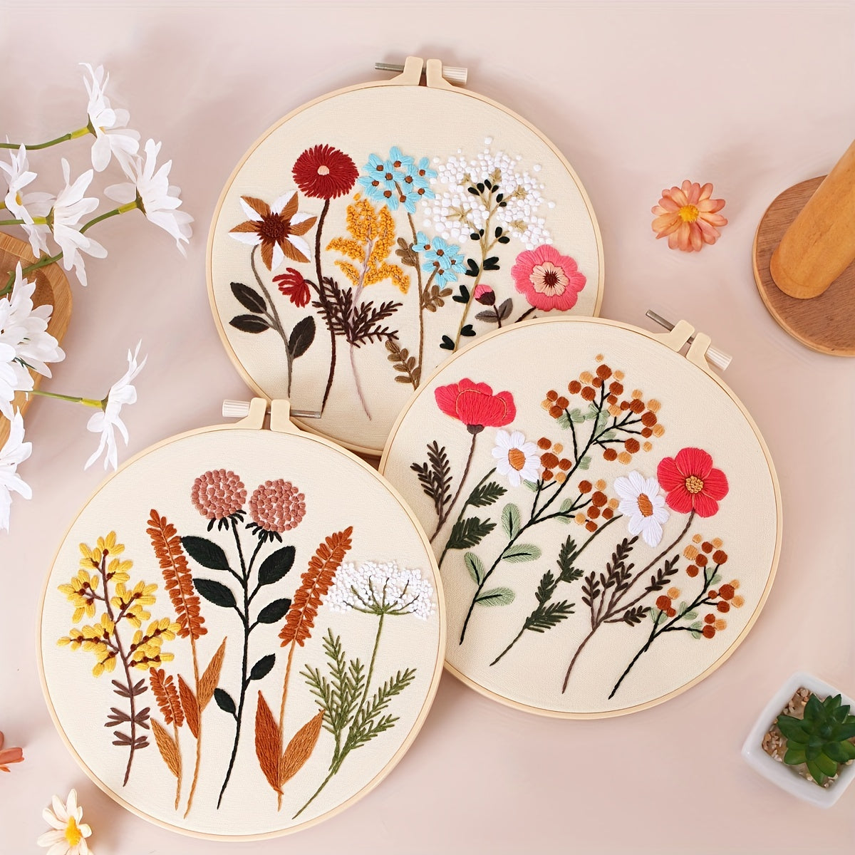 4-piece embroidery kit with floral pattern, hoops, floss threads, and needles, along with a 3-pack cross stitch kit for beginners.