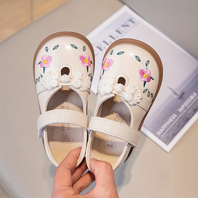 Girls' Mary Jane shoes with floral accents, soft non-slip sole for babies and toddlers.