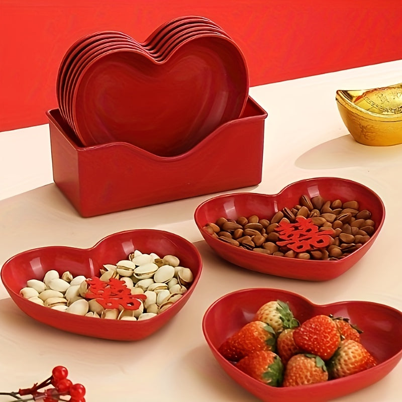 Heart-shaped plastic serving saucers in red for special occasions.