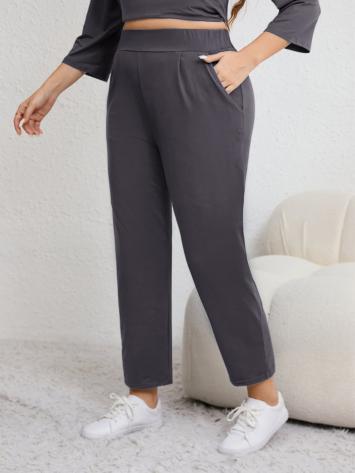 Plus size women's harem pants with high elasticity, ruched waist, pockets, and versatile for all seasons.