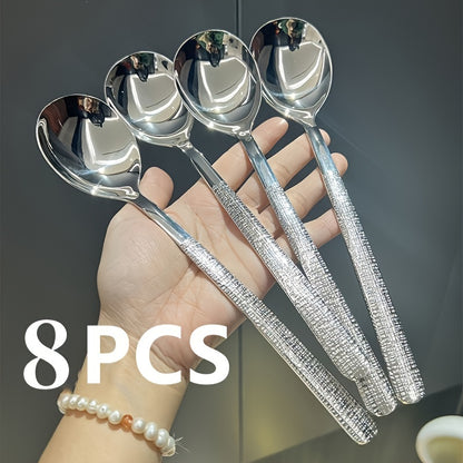 Durable stainless steel spoon with hammered round head design - ideal for kitchen and restaurant use. Easy to clean with a mirror polished finish. Suitable for soups, rice, and desserts.