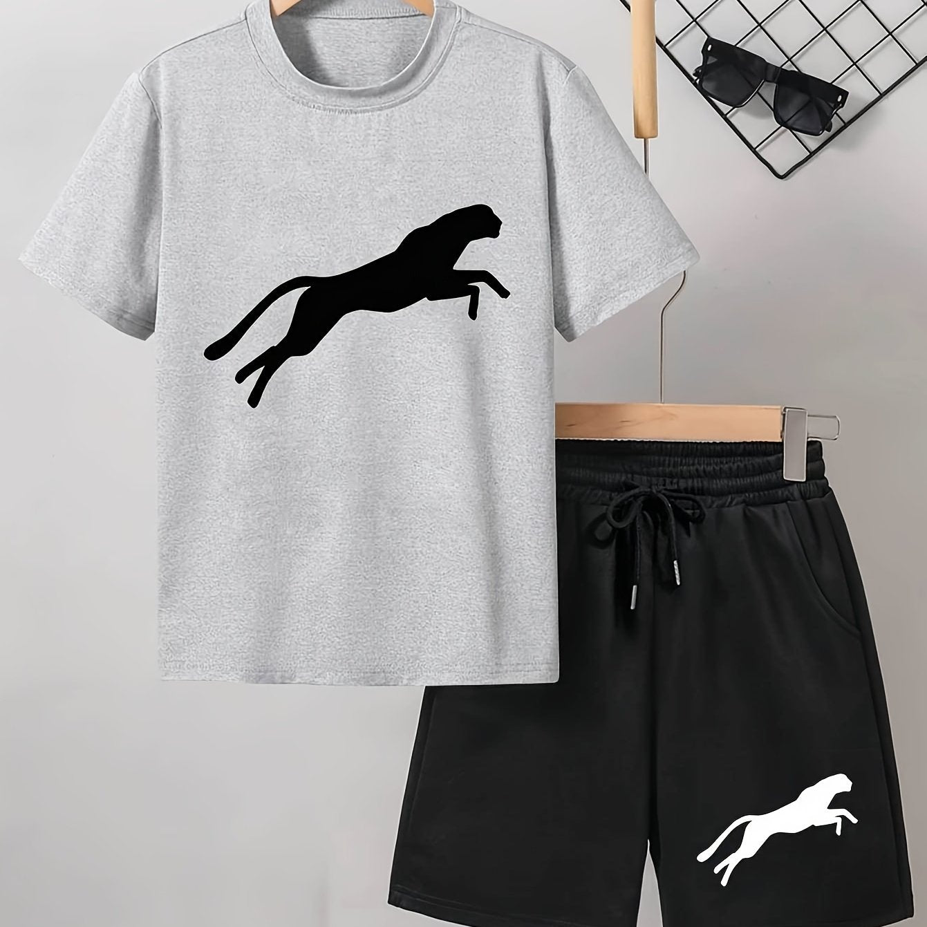 Men's casual Leopard Print Tee and Shorts Set in Light Gray with a Black Leopard silhouette on the t-shirt and White Leopard design on the black shorts. Made of a polyester blend for a