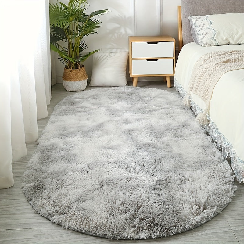 Soft and fluffy oval area rug, designed for use in living rooms, bedrooms, game rooms, and dormitories. Made of non-slip, washable polyester material. Machine-made shaggy rug perfect for adding a cozy touch to your space. Ideal for use as a bedside