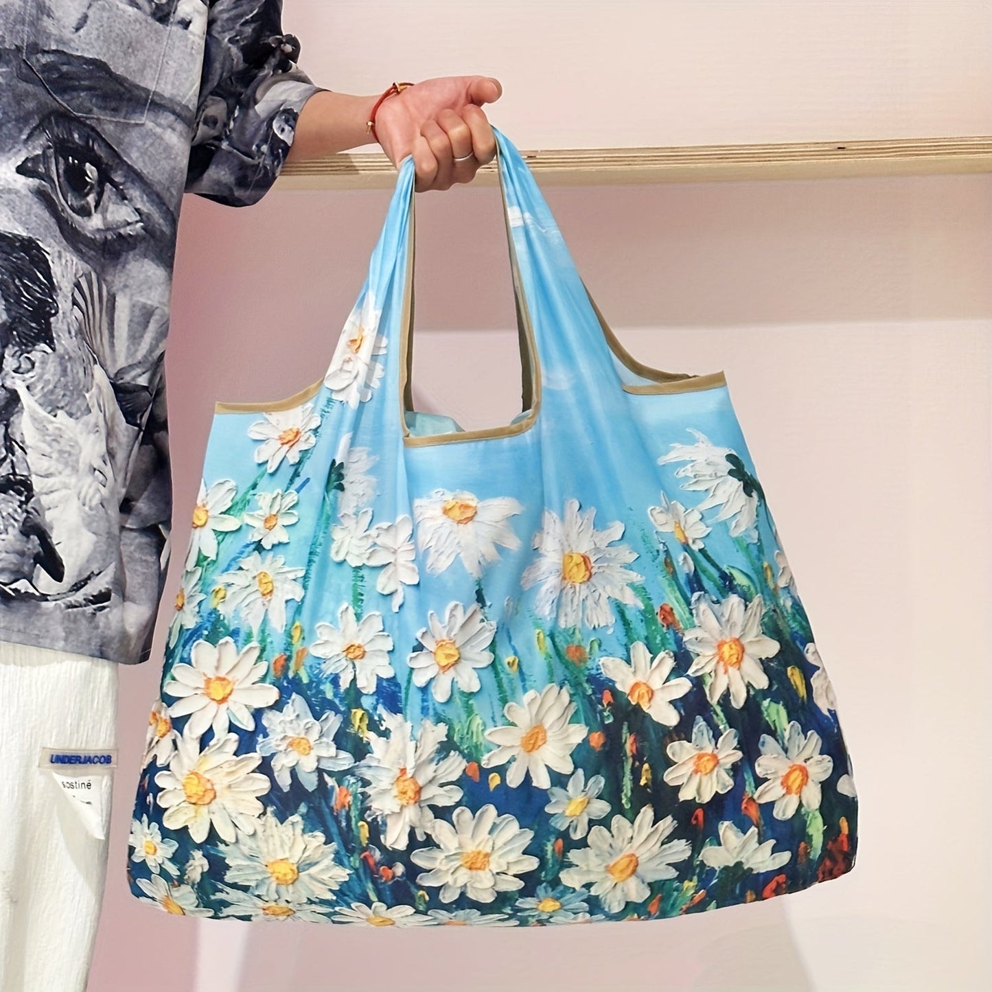 Reusable foldable grocery shopping tote bags featuring an oil painting pattern of flowers. Perfect for travel and conveniently fits in your pocket. Easily machine washable for reuse.