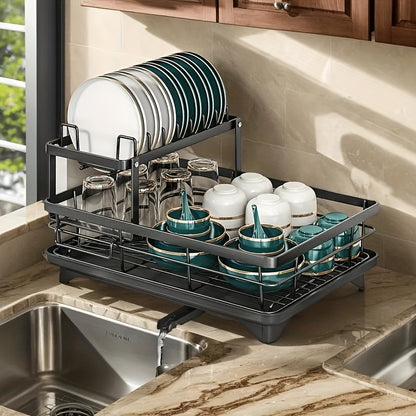 Black iron 2-tier kitchen dish rack with drainboard, utensil holder, cup hooks, and foldable design for space saving. Ideal for drying plates, bowls, pots, and cutlery.