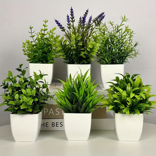 Small artificial white flowerpot with green plant, ideal for indoor home decoration. Can also be used as a mini green plant pot for offices, bathrooms, and bedrooms.